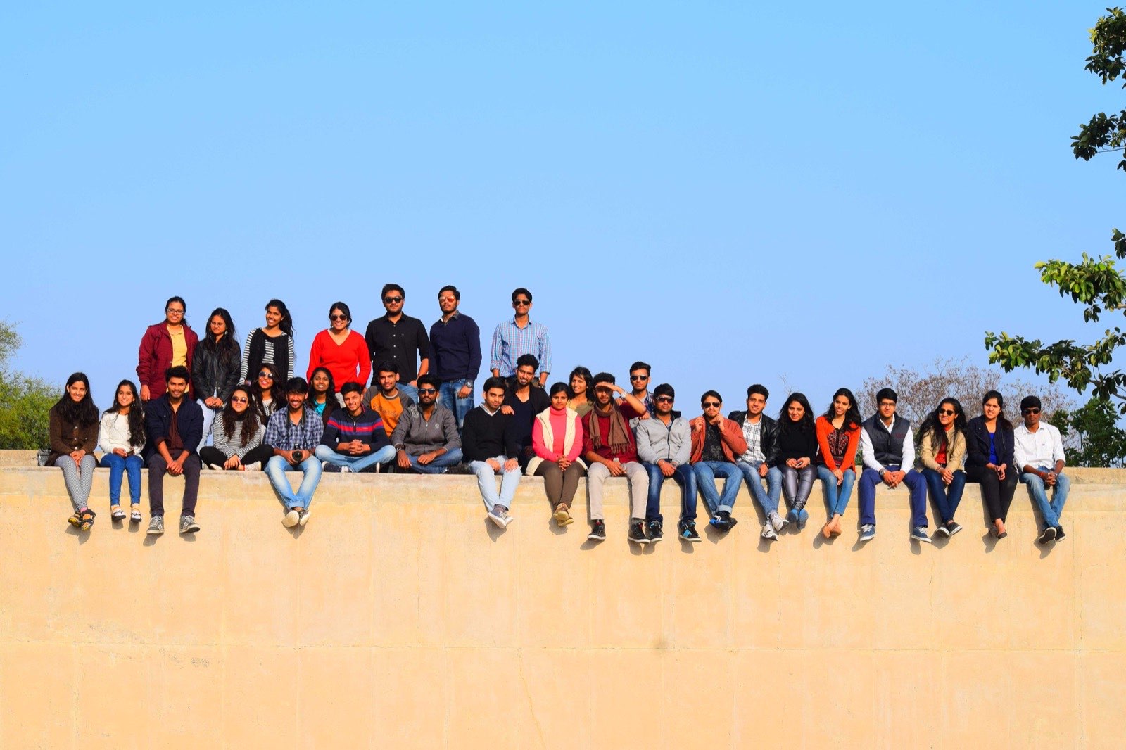 A large Bout India tour group on location in India